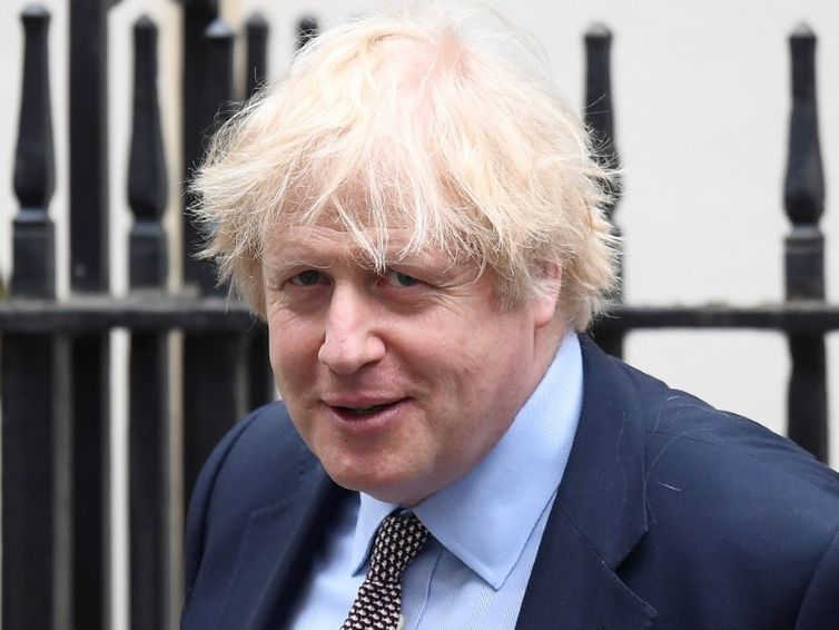 British Prime Minister Boris Johnson leaves his official residence in London