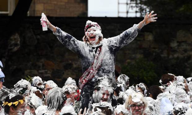 University of St Andrews students take part in the annual Shaving Foam Battle at Lower College Lawn in St Andrews, eastern Scotland. Photo: Andy Buchanan/AFP