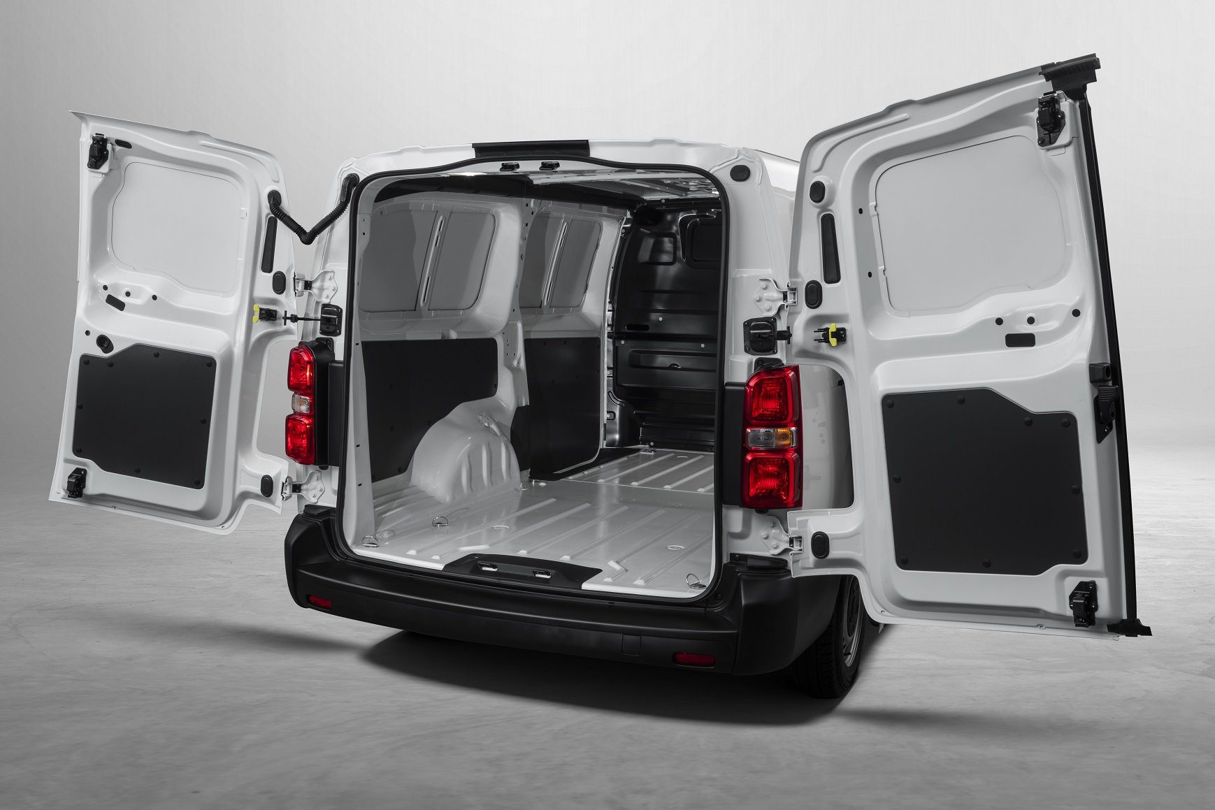 White Fiat Scudo with the rear doors open, leaving the loading compartment exposed