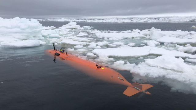 The Rán autonomous vehicle is among the sea ice in front of Thwaites, after a 20-hour mission mapping the sea floor