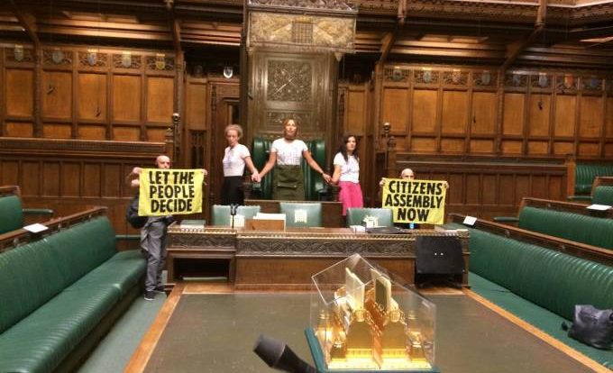 Climate activists invade British Parliament and stick themselves to a chair