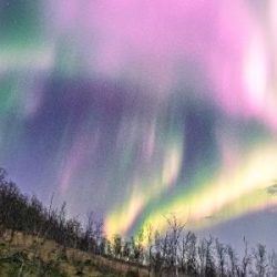 A solar storm causes the rare pink aurora in Norway